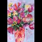 Vase of pink and yellow tulips
